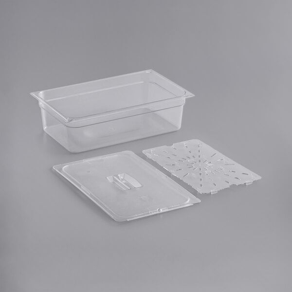 A clear plastic food pan with a lid and a plastic tray with holes.
