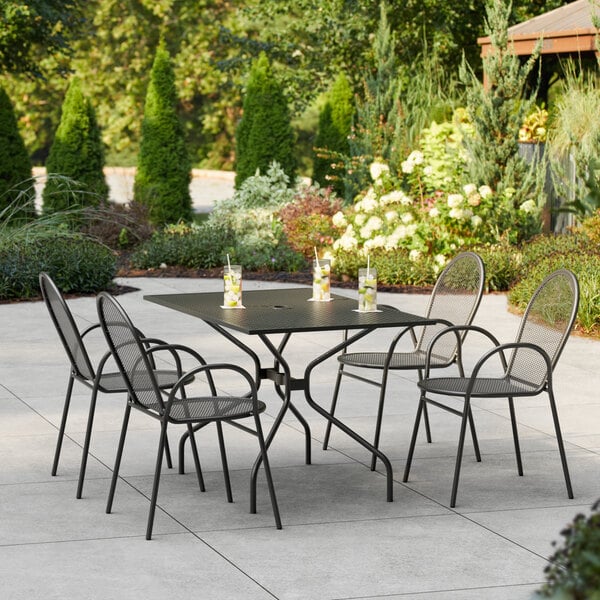 A Lancaster Table & Seating outdoor patio table with chairs.