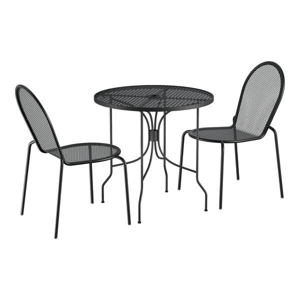 A Lancaster Table & Seating black metal outdoor bistro set with ornate legs on a table with two chairs.