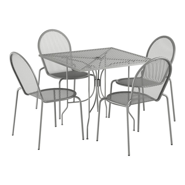 A Lancaster Table & Seating outdoor table and chair set with a square wire mesh top and ornate legs.