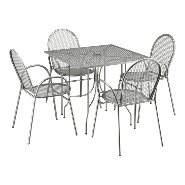 A Lancaster Table & Seating Harbor Gray square outdoor table with ornate legs and four arm chairs.