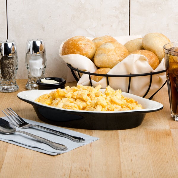 A plate of macaroni and cheese on a table.