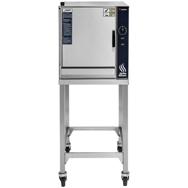 A Groen stainless steel pressureless electric steamer on wheels.