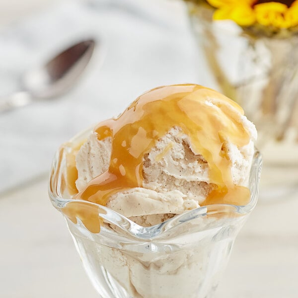 a bowl of ice cream with caramel sauce