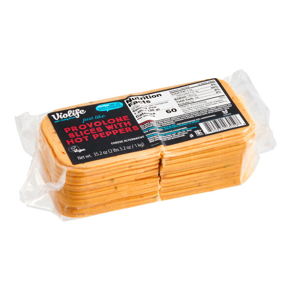 A package of Violife Just Like Provolone with Hot Peppers vegan cheese slices.
