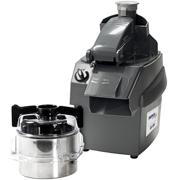 A Nemco combination food processor with a stainless steel bowl next to a juicer with a clear container.
