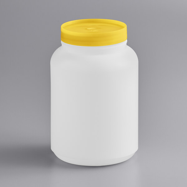 A white container with a yellow lid.