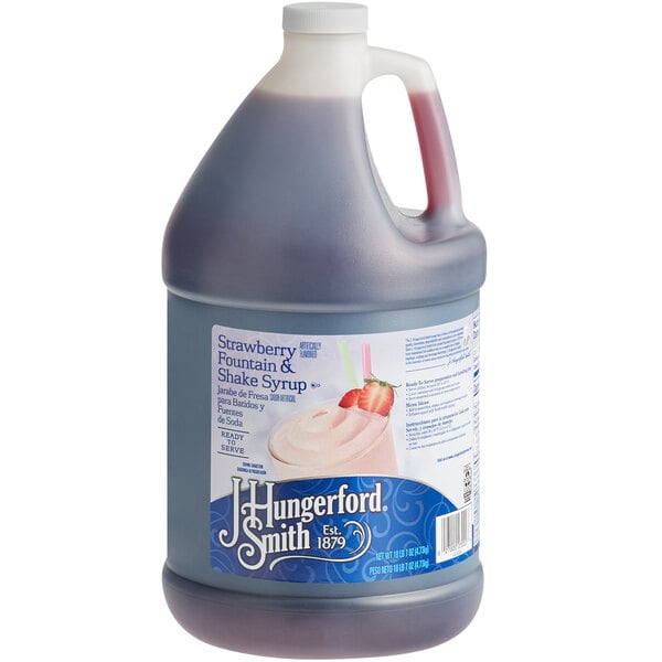 A white plastic jug of J. Hungerford Smith Strawberry syrup.