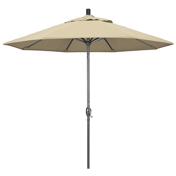 A close-up of a beige California Umbrella on a hammertone aluminum pole.