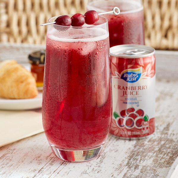 A glass of Ruby Kist cranberry juice cocktail with ice.