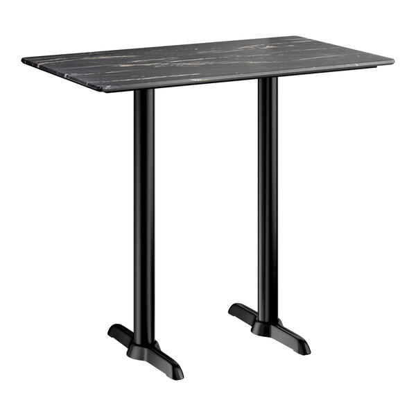 A rectangular bar height table with a smooth black finish and two sturdy black metal base plates.