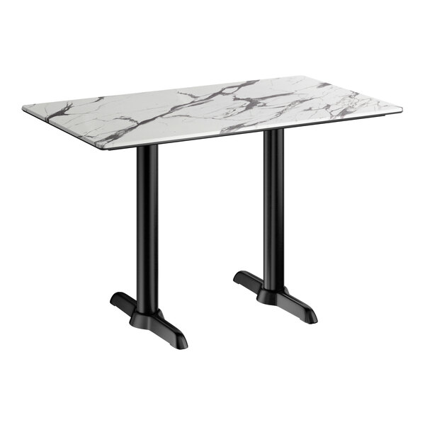 A rectangular table with a smooth white surface featuring dark veining and supported by two black metal legs with end base plates.