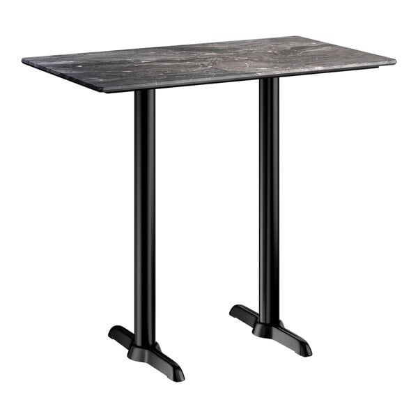 A rectangular bar height table with a smooth dark finish and two black metal end base plates.