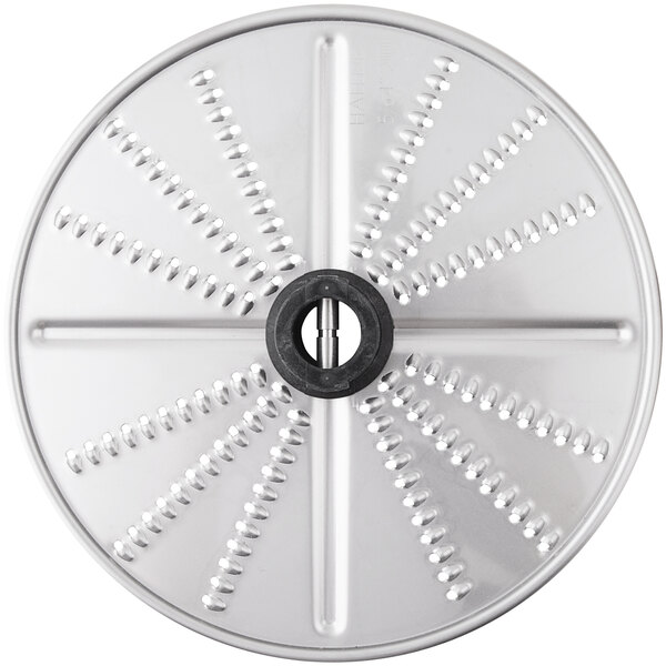 A circular metal Nemco grating/shredding disc with holes in it.