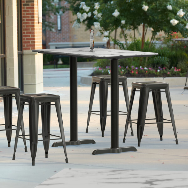 a pair of stools on a sidewalk