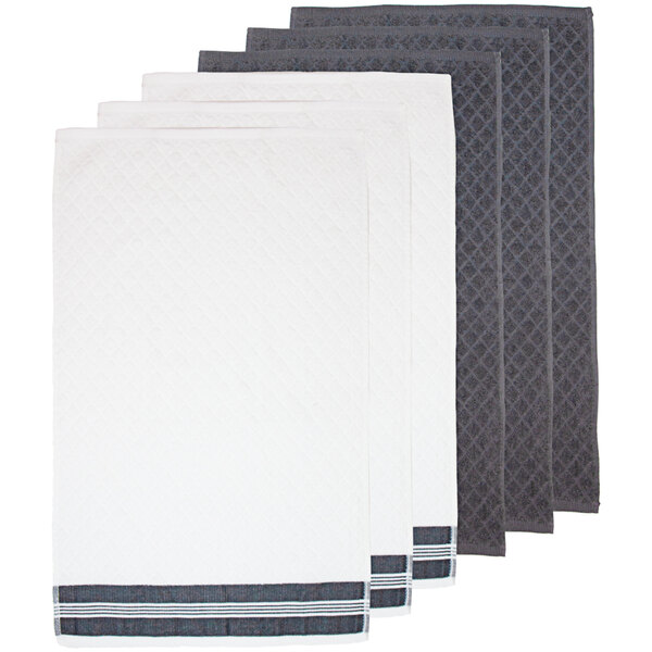 A stack of white Monarch Brands kitchen towels with a grey diamond pattern.
