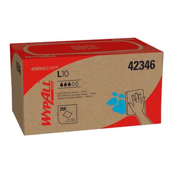 A cardboard box with red accents labeled 'WypAll L10' containing 250 white cleaning towels, featuring an illustration of a hand wiping a blue spill.