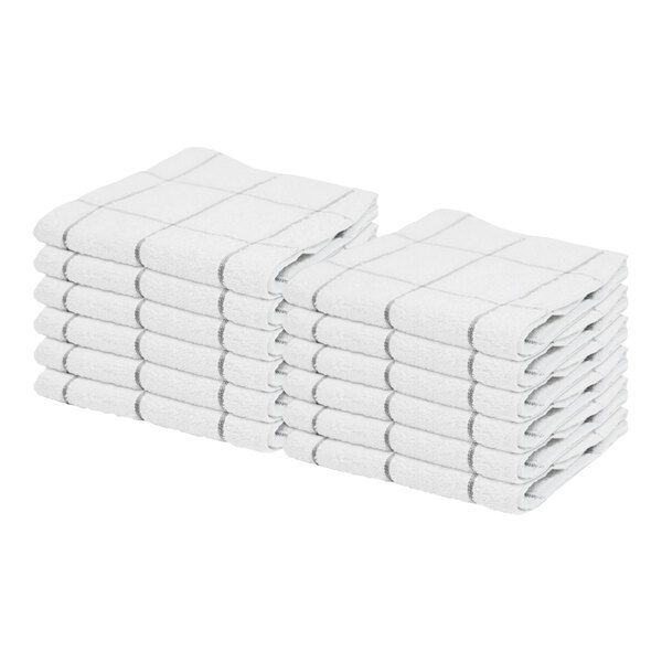A stack of twelve white dish cloths with a gray windowpane pattern, neatly folded.