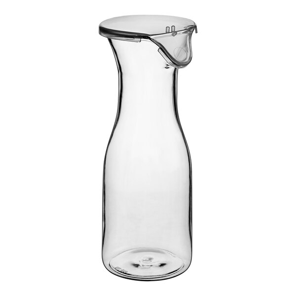 A clear polycarbonate wine decanter with a lid.