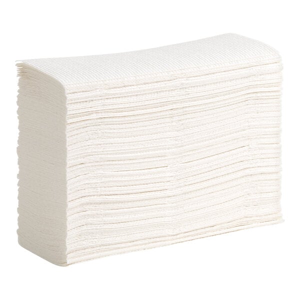 A large stack of white Kleenex M-Fold paper towels.