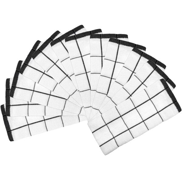 A group of black and white windowpane patterned Monarch Brands kitchen towels.