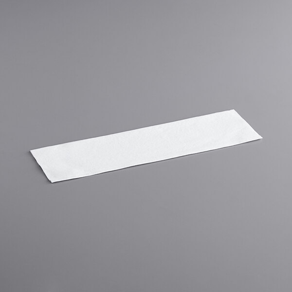 a white rectangular object on a gray surface