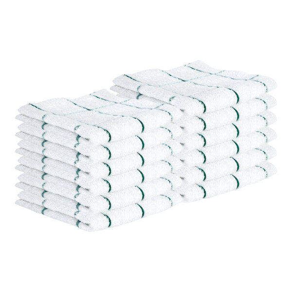 A stack of white dish cloths with green windowpane patterns, neatly folded in two rows.