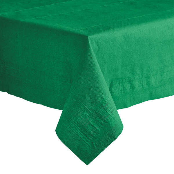 A jade green Hoffmaster table cover with a folded edge on a table.