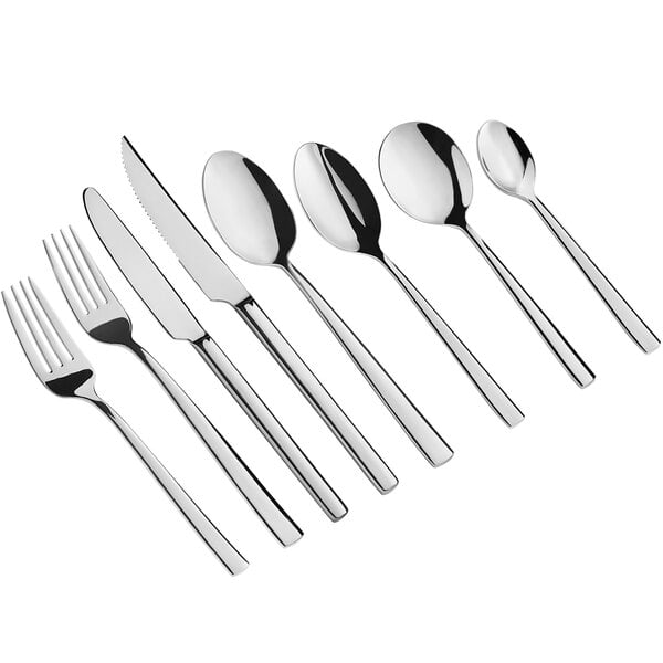 A close-up of several Acopa Skyscraper stainless steel bouillon spoons.