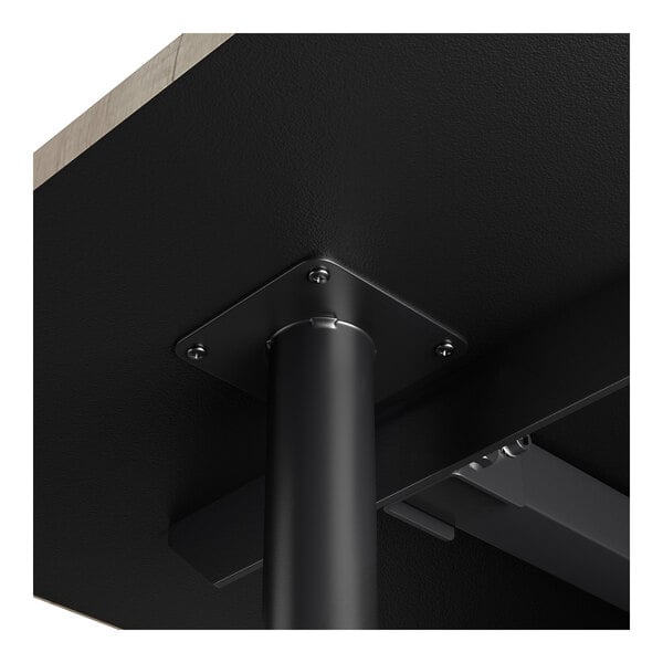 A close-up view of a black metal pin leg attached to the underside of a table, designed for use with cantilever table bases.