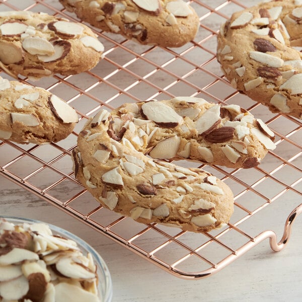 A close up of an almond cookie on a cooling rack.