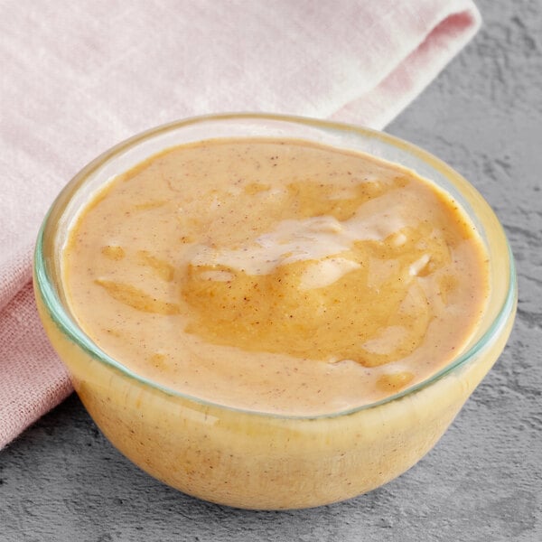 A bowl of American almond praline on a table.