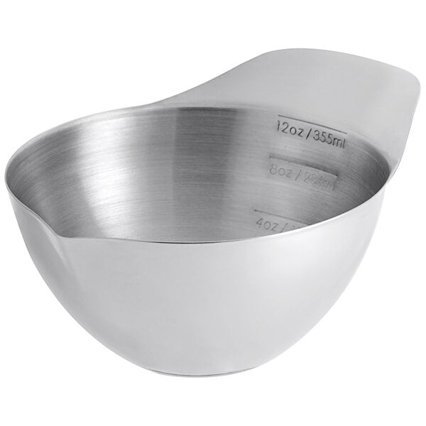 A Vollrath stainless steel transfer bowl with a handle.