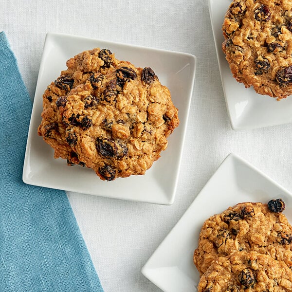 A Thompson raisin oatmeal cookie on a white plate.