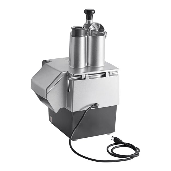 A metallic and black countertop appliance with two cylindrical feed chutes, a handle, and an attached power cord.
