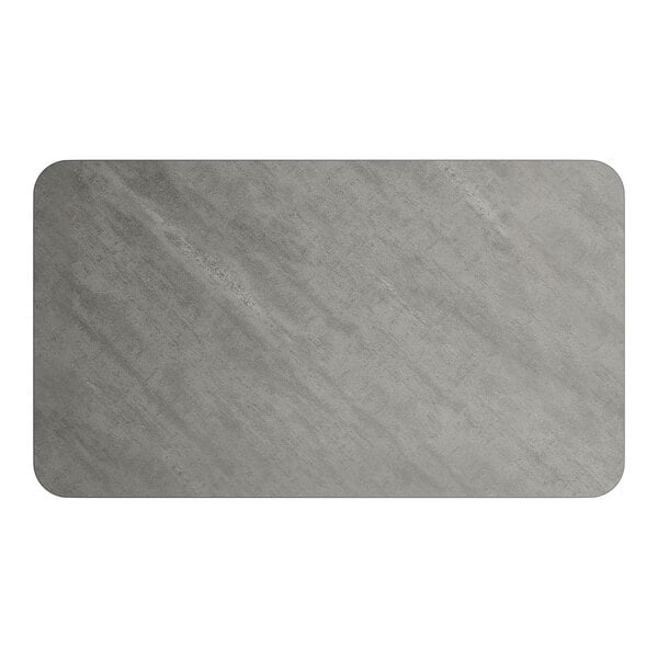 A rectangular reversible laminated table top with a white and gray slate finish.