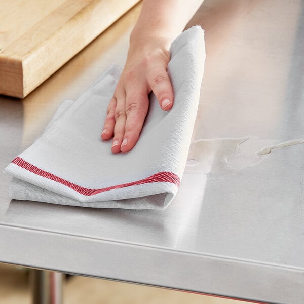 a hand on a white towel