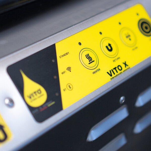 The yellow and black Vito label on a Vito Fryfilter machine.