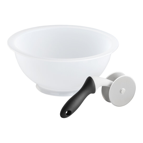 A white plastic mixing bowl and a handheld chopper with a black handle and dual stainless steel blades.