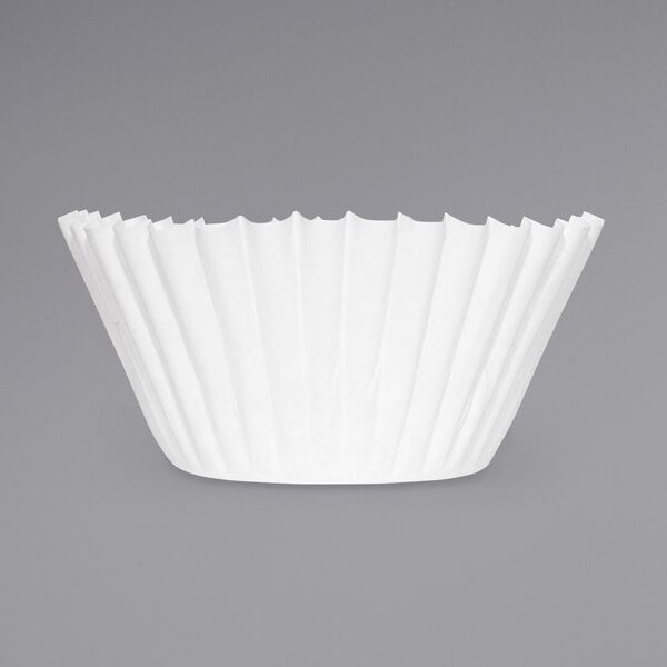 A white paper coffee filter with a gray background.