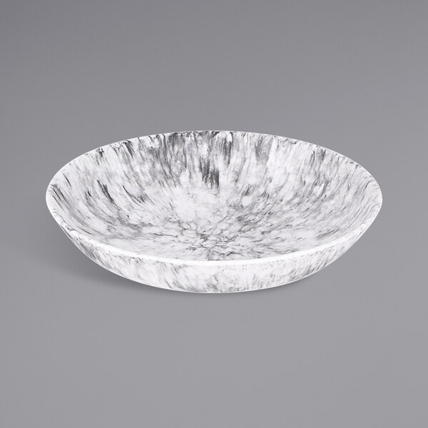 A white bowl with a black marble embossed surface.