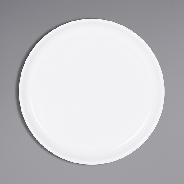 a white plate on a gray surface