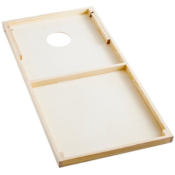 A Backyard Pro rustic dark wood cornhole board with a hole in it.