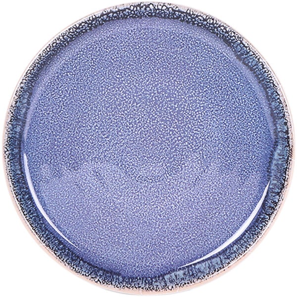 An Elite Global Solutions Monet indigo melamine plate with a speckled design on the surface.