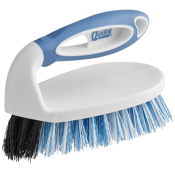 A blue and white Quickie Iron Scrub Brush with a handle.