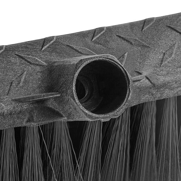 a black broom with a round hole