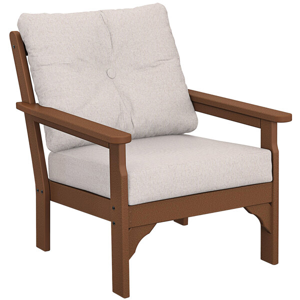A POLYWOOD Vineyard teak deep seating chair with a white cushion.