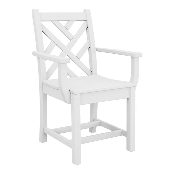 A white dining arm chair with a geometric backrest design and armrests.