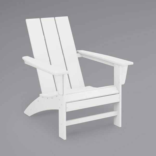 A white POLYWOOD modern Adirondack chair with armrests.