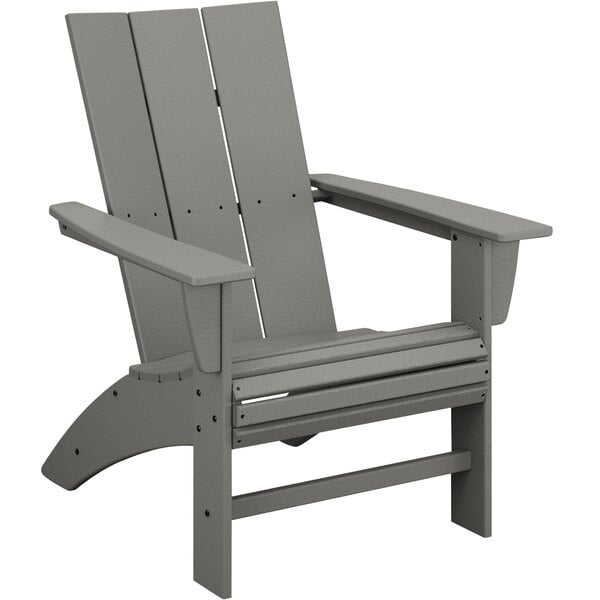 A POLYWOOD slate grey Adirondack chair with armrests.